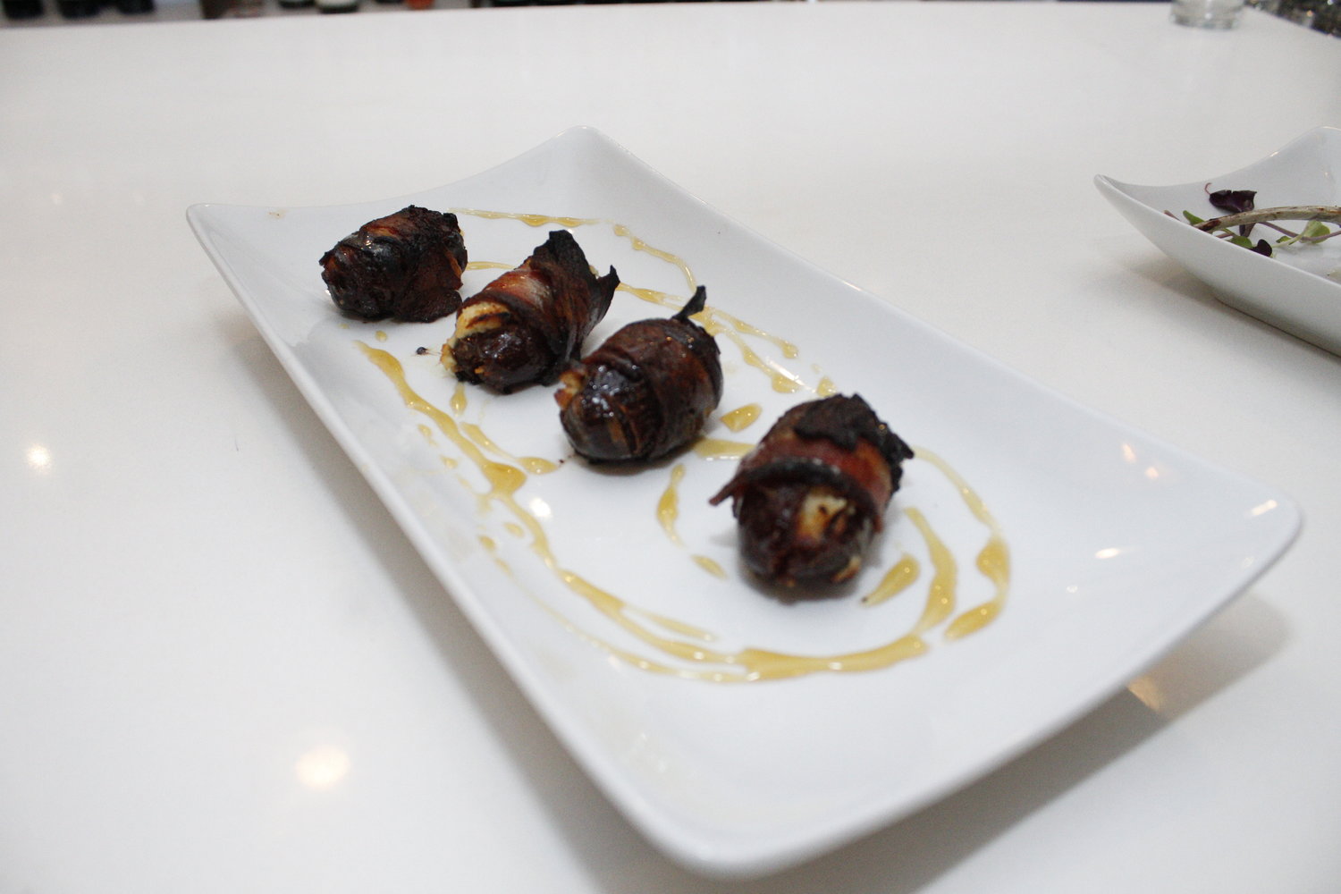 The bacon-wrapped dates stuffed with goat cheese are the perfect savory appetizer.
